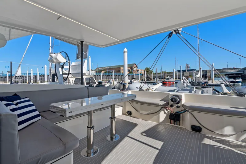Navitas Yacht Photos Pics Luxurious 2019 Itacatamarans 14.99 yacht interior with marina view and modern seating area.