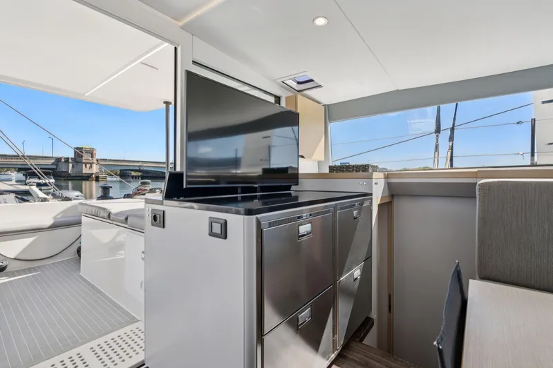 Navitas Yacht Photos Pics Modern interior of 2019 Itacatamarans 14.99 yacht with sleek design and waterfront view.