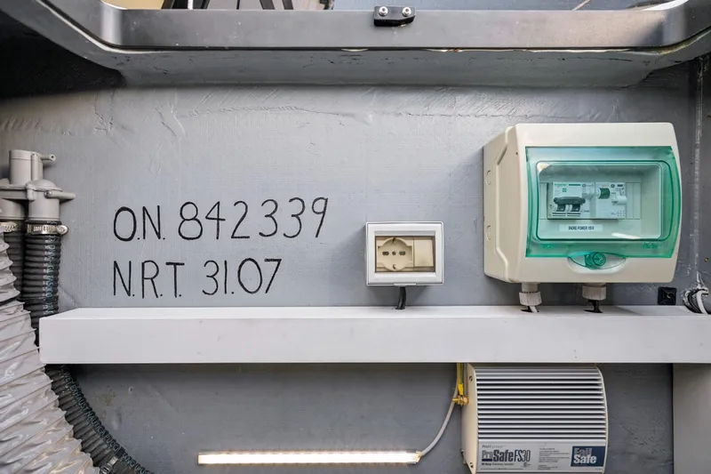 Navitas Yacht Photos Pics Electrical panel and outlet on Itacatamarans 14.99, 2019 model, with serial number and NRT details.