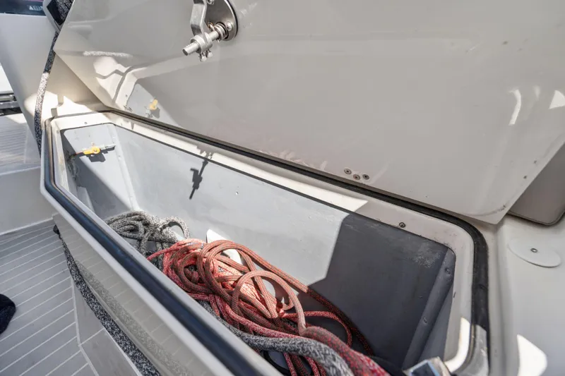 Navitas Yacht Photos Pics Open storage compartment on 2019 Itacatamarans 14.99 with coiled ropes inside.