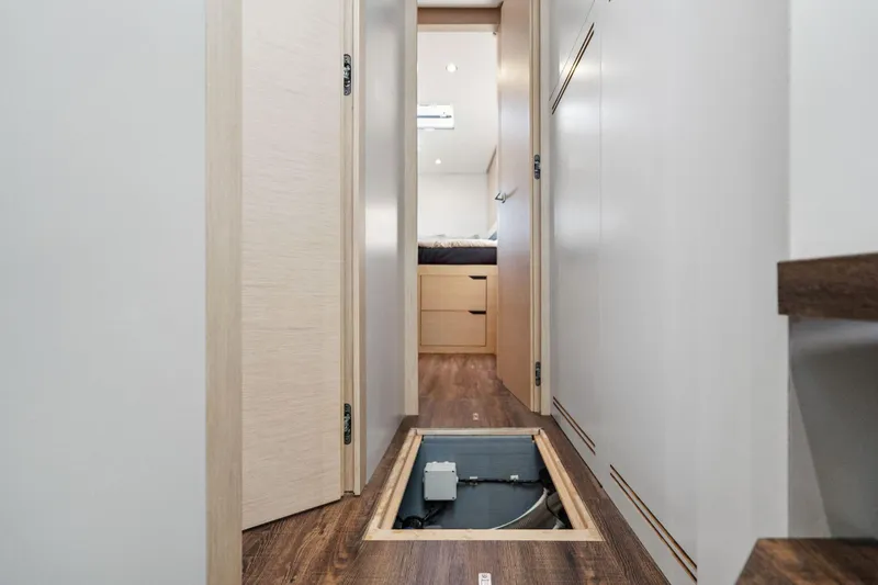 Navitas Yacht Photos Pics 2019 Itacatamarans 14.99 interior hallway with open floor hatch, modern design.
