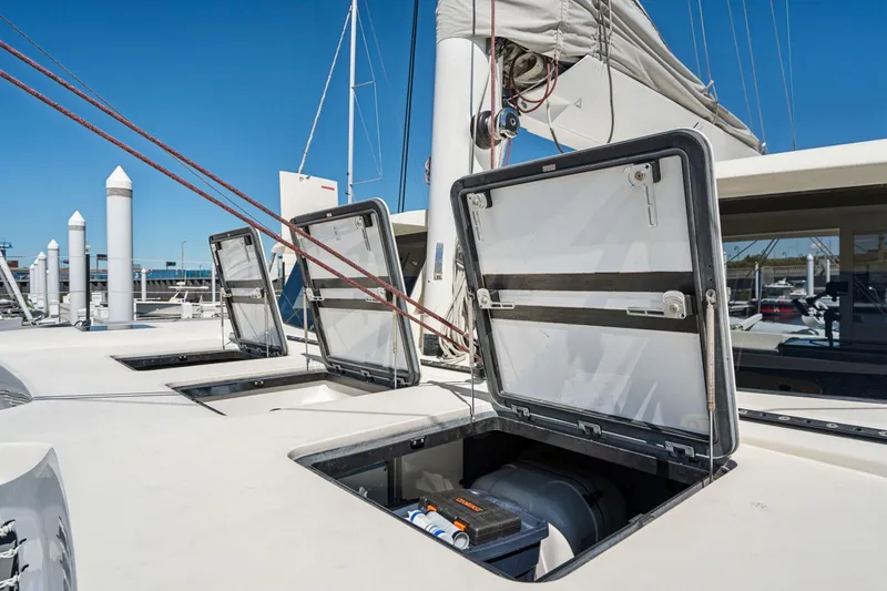 Navitas Yacht Photos Pics 2019 Itacatamarans 14.99 yacht deck with open hatches at marina.