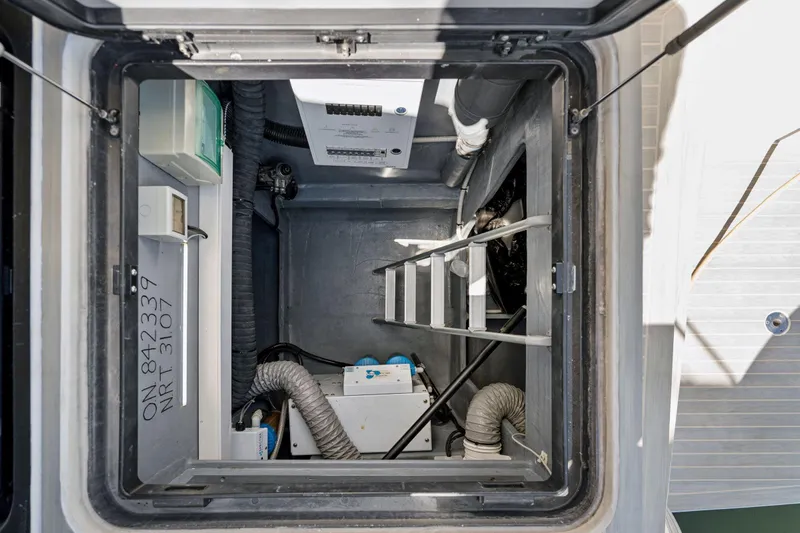 Navitas Yacht Photos Pics Engine room of 2019 Itacatamarans 14.99, featuring equipment and access ladder.