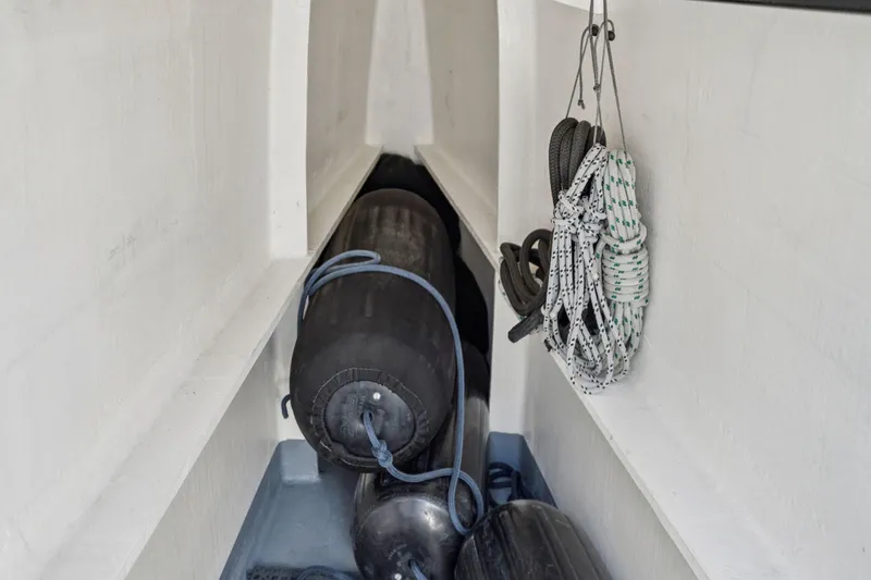 Navitas Yacht Photos Pics Storage area on 2019 Itacatamarans 14.99 with ropes and fenders.