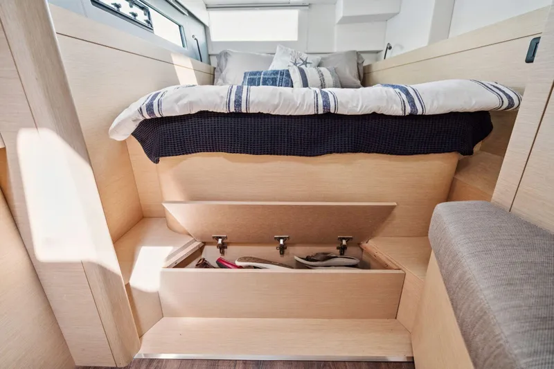 Navitas Yacht Photos Pics Interior of 2019 Itacatamarans 14.99 with under-bed storage and cozy bedding.