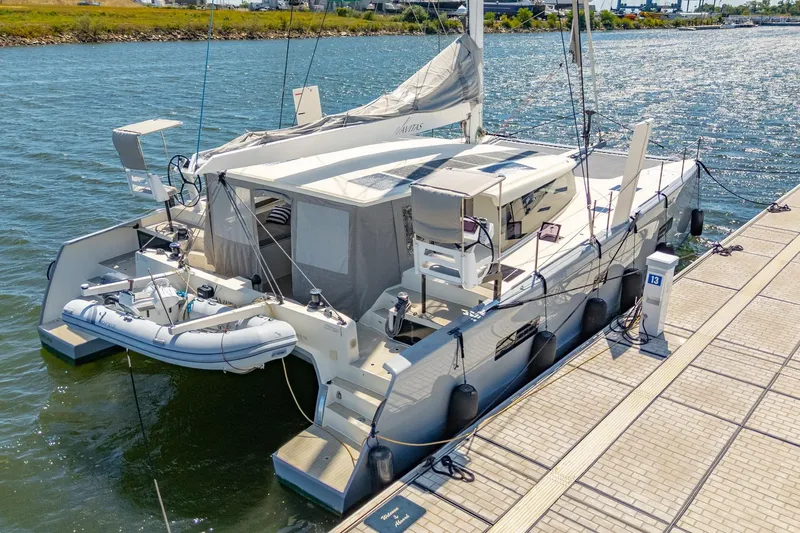 Navitas Yacht Photos Pics 2019 Itacatamarans 14.99 catamaran docked, featuring sleek design and modern amenities.