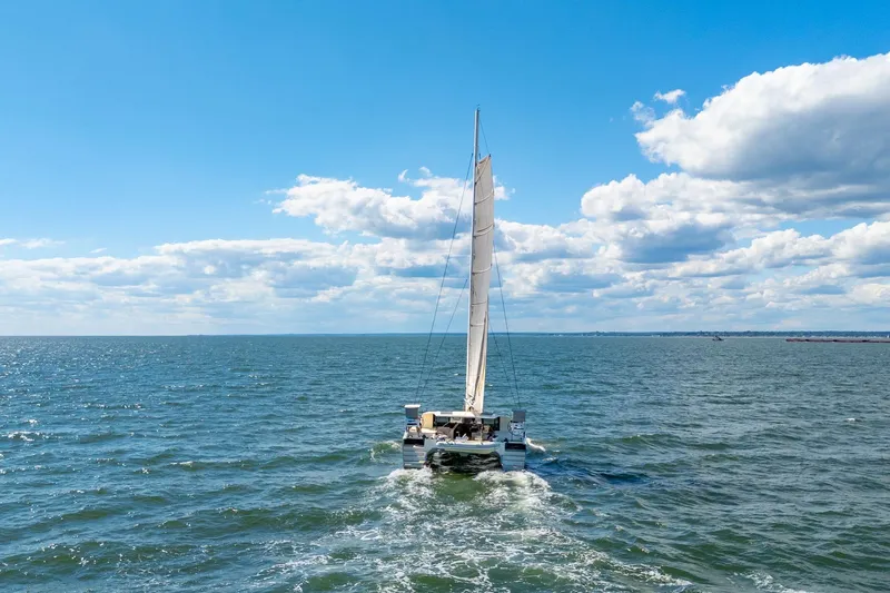Navitas Yacht Photos Pics Sailing Itacatamarans 14.99 catamaran on open sea under blue sky, 2019 model.