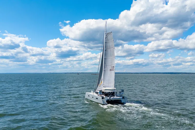Navitas Yacht Photos Pics 2019 Itacatamarans 14.99 sailing on open sea under a clear blue sky.