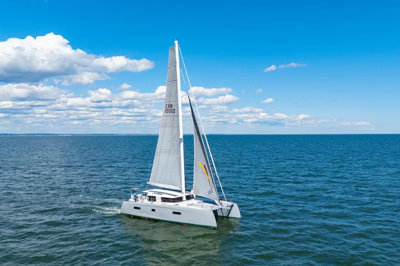 Navitas Yacht Photos Pics 2019 Itacatamarans 14.99 sailing on open sea under clear blue sky.