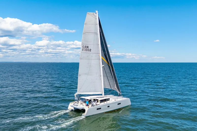 Navitas Yacht Photos Pics 2019 Itacatamarans 14.99 sailing on open sea under clear blue sky.