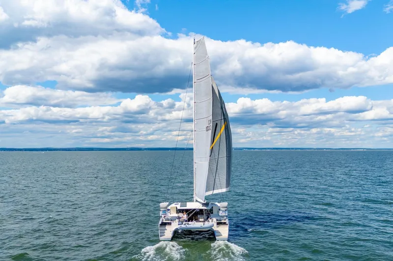 Navitas Yacht Photos Pics 2019 Itacatamarans 14.99 sailing on open sea under a clear blue sky.
