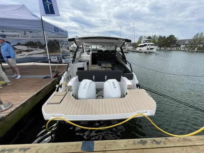 Inventory Clearance Yacht Photos Pics 2023 Bavaria Vida 33 yacht docked at marina, showcasing sleek design and powerful engines.