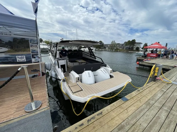 Inventory Clearance Yacht Photos Pics 2023 Bavaria Vida 33 motorboat docked at marina, showcasing sleek design and powerful engines.