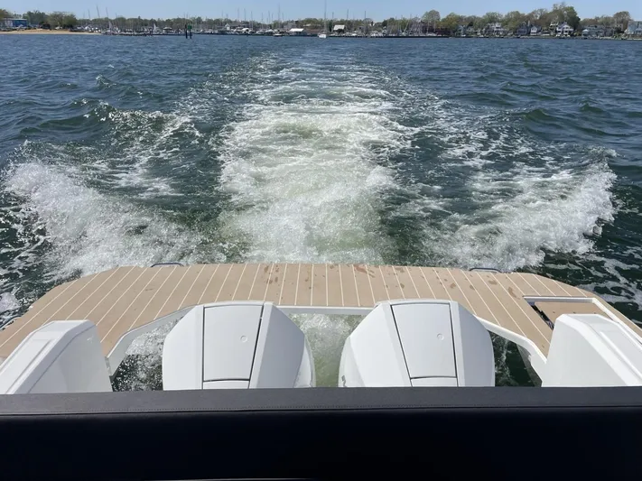 Inventory Clearance Yacht Photos Pics 2023 Bavaria Vida 33 boat cruising on open water, leaving a wake behind.