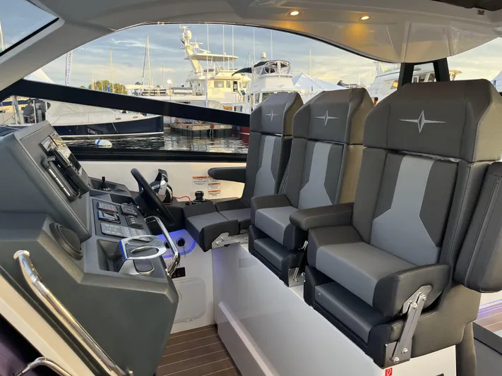 Inventory Clearance Yacht Photos Pics Interior of 2023 Bavaria Vida 33 boat with modern helm and seating.
