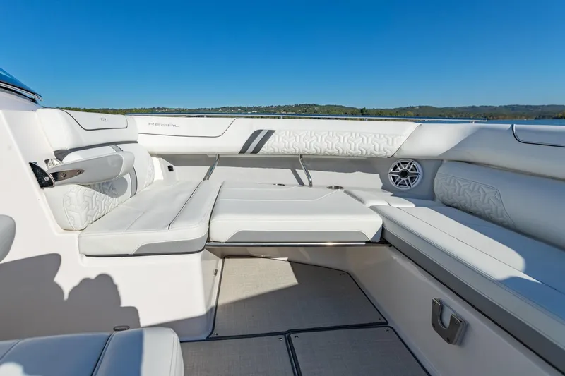 The Big Dill Yacht Photos Pics 2023 Regal LS36 boat interior with luxurious white seating and scenic lake view.