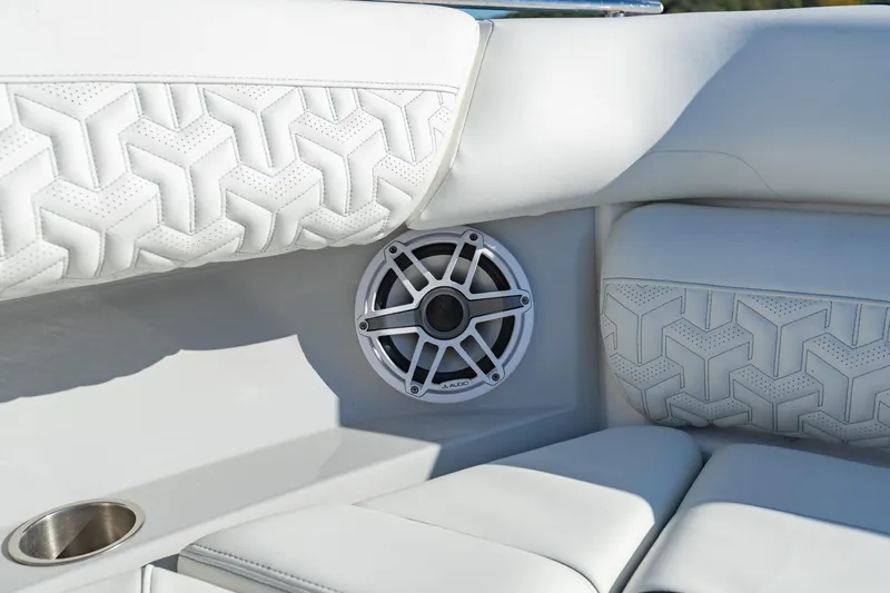 The Big Dill Yacht Photos Pics Luxurious white seating with speaker detail on 2023 Regal LS36 boat.
