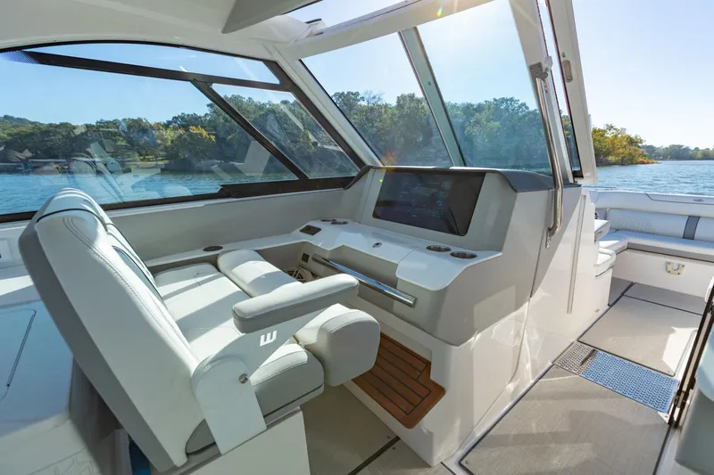 The Big Dill Yacht Photos Pics 2023 Regal LS36 boat interior with modern helm and comfortable seating on a sunny day.