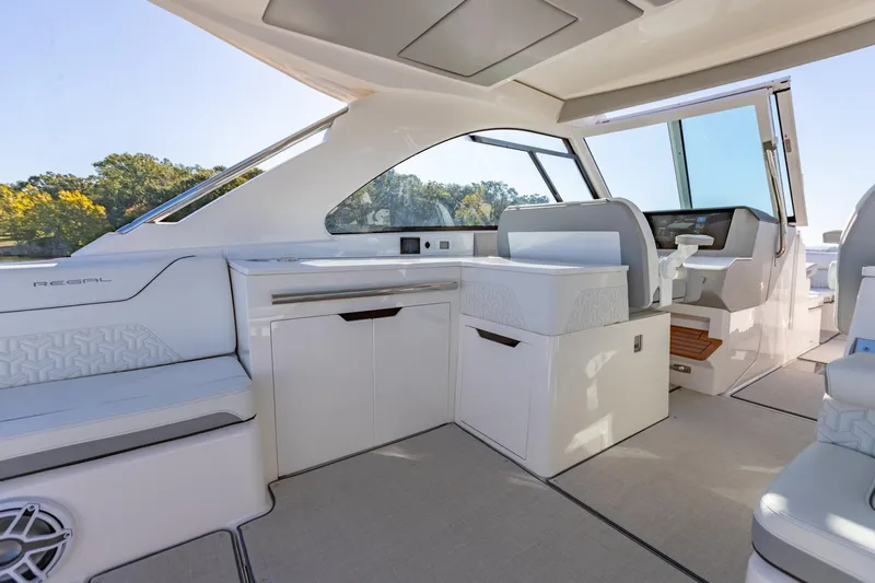 The Big Dill Yacht Photos Pics 2023 Regal LS36 boat interior with modern seating and sleek design.