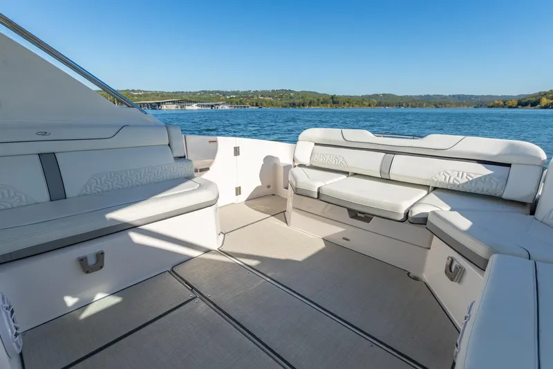 The Big Dill Yacht Photos Pics Luxurious 2023 Regal LS36 boat interior with spacious seating and scenic lake view.