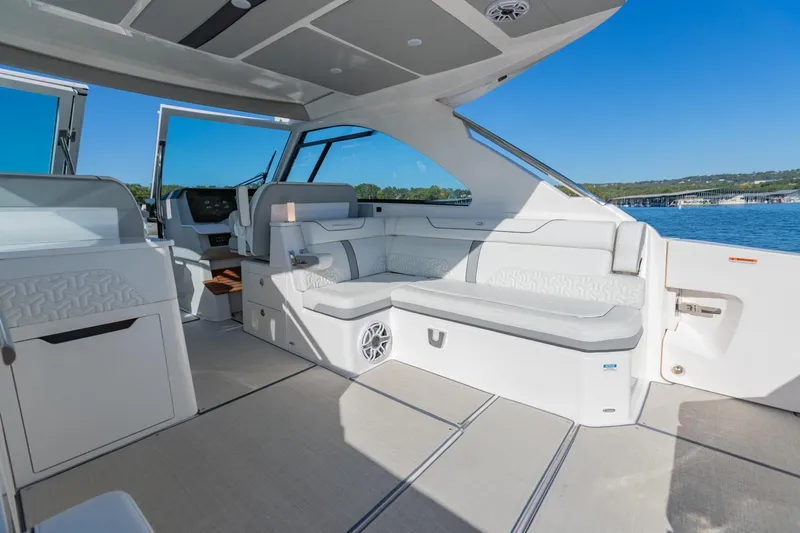 The Big Dill Yacht Photos Pics Luxurious interior of 2023 Regal LS36 boat with spacious seating and modern design.