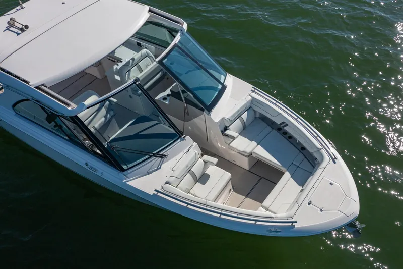The Big Dill Yacht Photos Pics 2023 Regal LS36 boat on water, featuring sleek design and spacious seating.