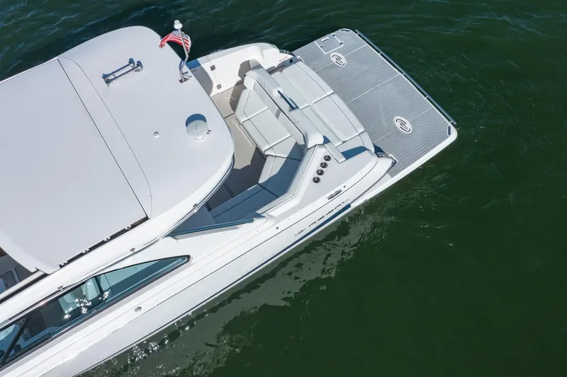 The Big Dill Yacht Photos Pics 2023 Regal LS36 luxury boat on water, aerial view, sleek design, spacious deck.