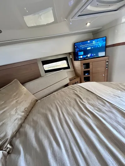  Yacht Photos Pics Luxurious interior of 2025 Boston Whaler 365 Conquest with bed and TV.