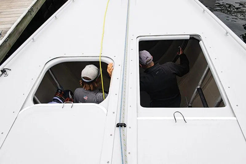 Enterprise Yacht Photos Pics Two people inside a 1997 Sparkman & Stephens 12M yacht, viewed from above.