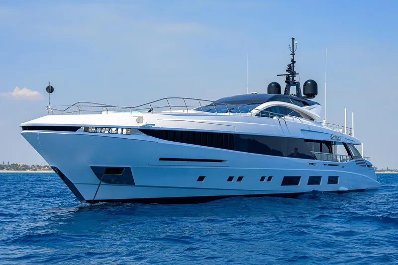 Goldeneye Yacht Photos Pics Luxurious 2020 Mangusta 54 Gransport yacht cruising on open blue sea.