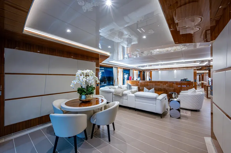 Goldeneye Yacht Photos Pics Luxurious interior of 2020 Mangusta 54 Gransport yacht with elegant seating and modern decor.