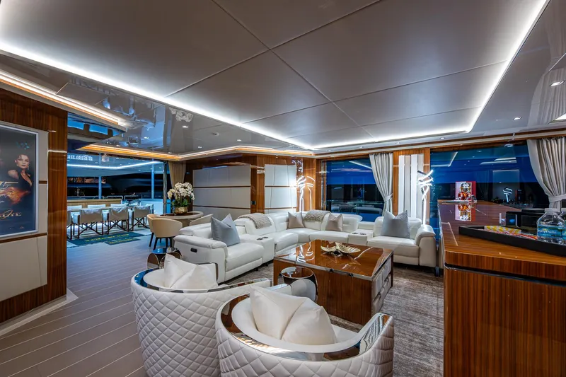 Goldeneye Yacht Photos Pics Luxurious interior of 2020 Mangusta 54 Gransport yacht with elegant seating and modern decor.