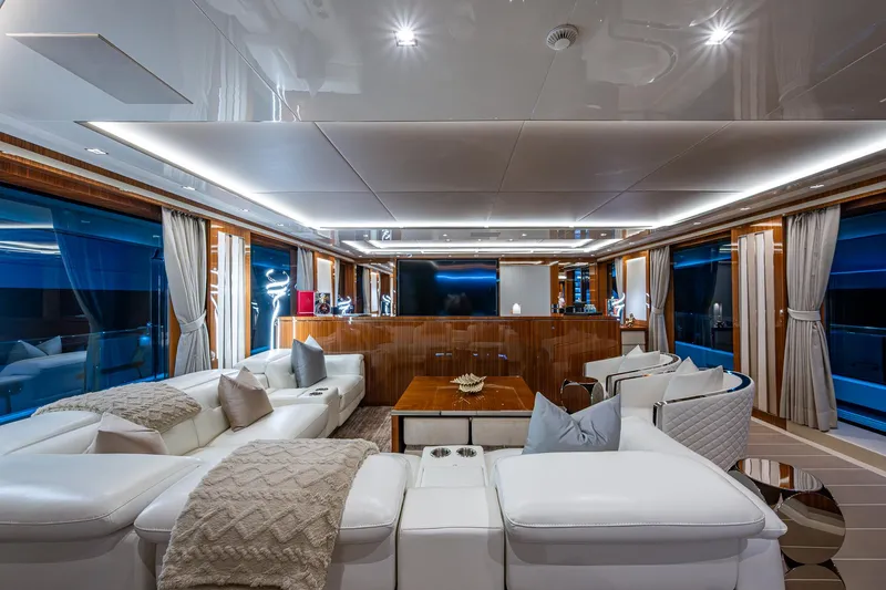 Goldeneye Yacht Photos Pics Luxurious interior of 2020 Mangusta 54 Gransport yacht with elegant seating and modern decor.