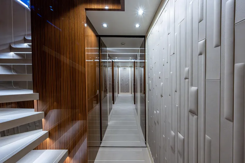 Goldeneye Yacht Photos Pics Luxurious interior hallway of 2020 Mangusta 54 Gransport yacht with modern design.