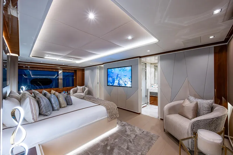 Goldeneye Yacht Photos Pics Luxurious interior of 2020 Mangusta 54 Gransport yacht with elegant bedroom and modern decor.