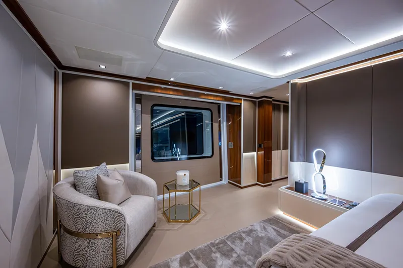 Goldeneye Yacht Photos Pics Luxurious interior of 2020 Mangusta 54 Gransport yacht, featuring elegant seating and modern lighting.