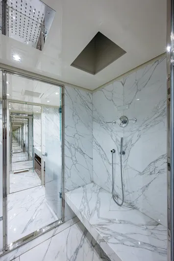 Goldeneye Yacht Photos Pics Luxurious marble bathroom interior on the 2020 Mangusta 54 Gransport yacht.