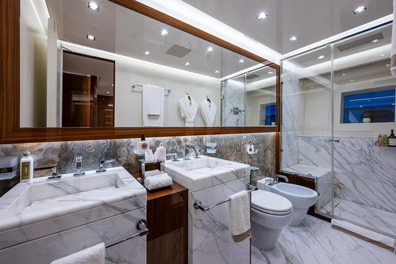 Goldeneye Yacht Photos Pics Luxurious bathroom in 2020 Mangusta 54 Gransport yacht with marble finishes and modern fixtures.