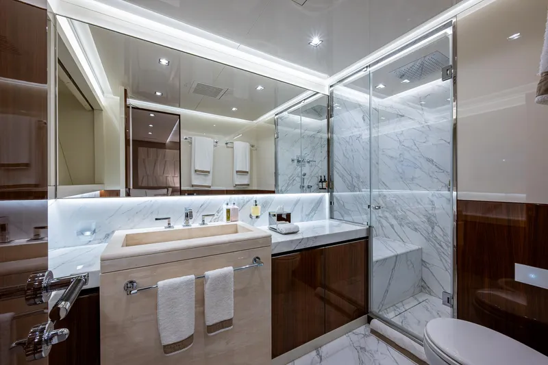 Goldeneye Yacht Photos Pics Luxurious bathroom in 2020 Mangusta 54 Gransport yacht with marble and wood finishes.