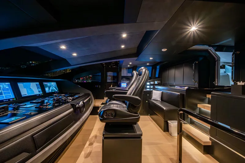 Goldeneye Yacht Photos Pics Luxurious interior of 2020 Mangusta 54 Gransport yacht with modern control panel and seating.