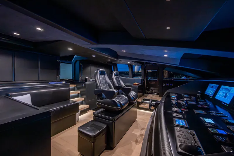 Goldeneye Yacht Photos Pics Luxurious interior of 2020 Mangusta 54 Gransport yacht with modern control panel and seating.