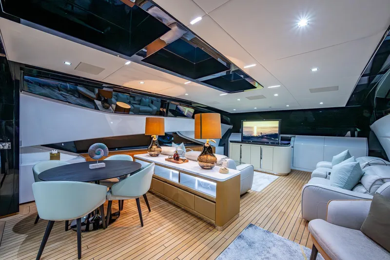 Goldeneye Yacht Photos Pics Luxurious interior of 2020 Mangusta 54 Gransport yacht with modern furnishings and ambient lighting.