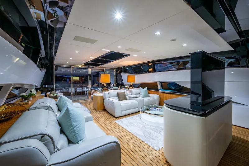 Goldeneye Yacht Photos Pics Luxurious interior of 2020 Mangusta 54 Gransport yacht with modern furnishings and ambient lighting.