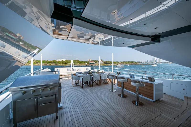 Goldeneye Yacht Photos Pics Luxurious deck of 2020 Mangusta 54 Gransport yacht with ocean view and modern amenities.