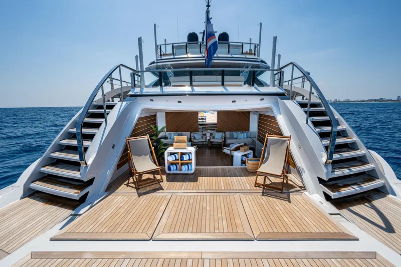 Goldeneye Yacht Photos Pics Luxurious 2020 Mangusta 54 Gransport yacht deck with elegant seating and ocean view.