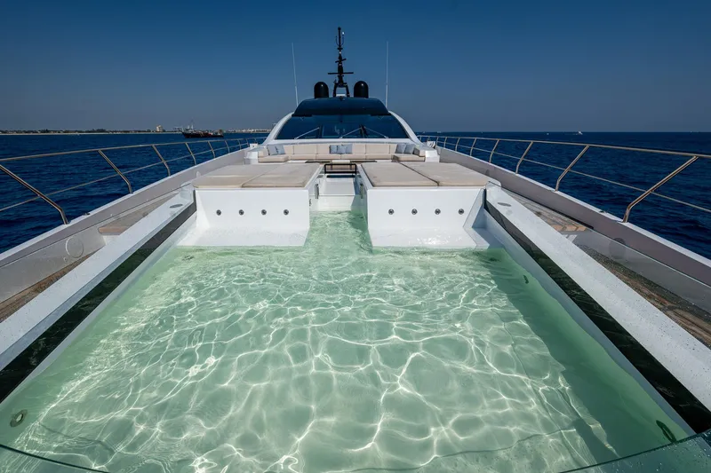 Goldeneye Yacht Photos Pics Luxury yacht Mangusta 54 Gransport 2020 with onboard pool, cruising on open sea.