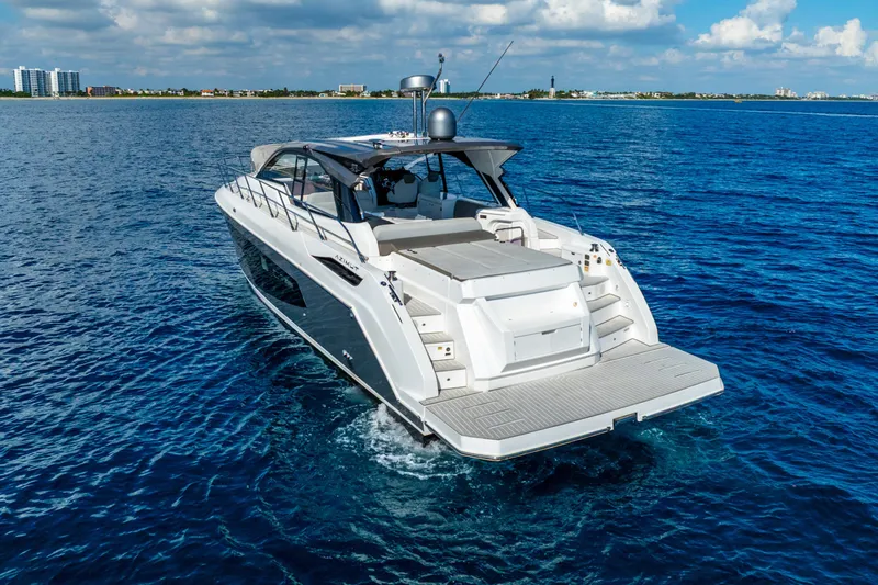  Yacht Photos Pics 2021 Azimut Atlantis 51 yacht cruising on open blue sea under clear skies.