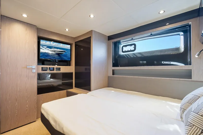  Yacht Photos Pics Luxurious cabin interior of 2021 Azimut Atlantis 51 yacht with modern amenities.