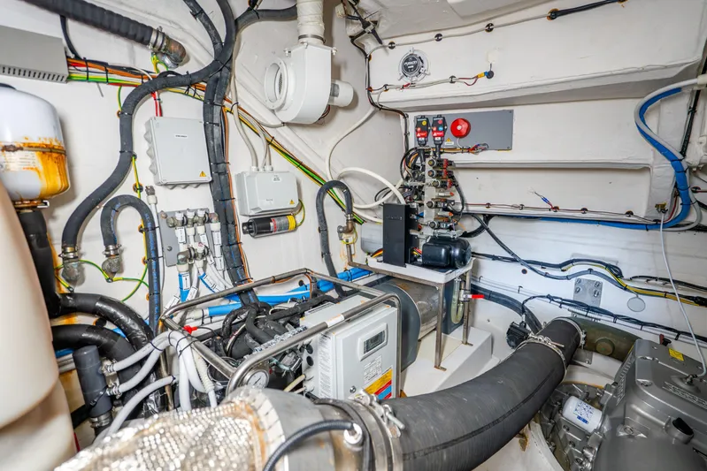  Yacht Photos Pics Engine room of 2021 Azimut Atlantis 51 yacht with complex wiring and machinery.
