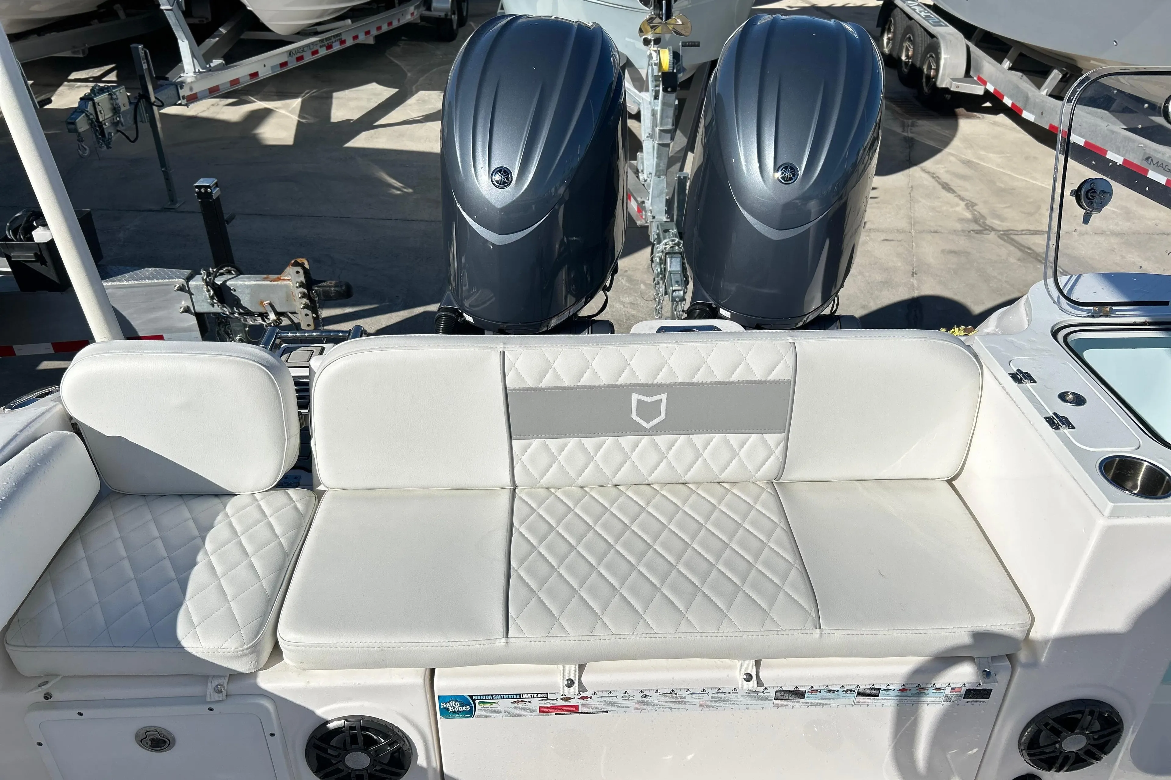 2024 Sea Fox 268 Commander boat interior with dual engines and cushioned seating.